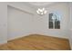 Dining room with hardwood floors, large window, and modern chandelier at 2265 Lauren Dr, Las Vegas, NV 89134
