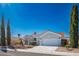 Charming single-story home with a well-maintained lawn and desert landscaping at 2265 Lauren Dr, Las Vegas, NV 89134