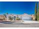 Charming single-story stucco home with desert landscaping and a two-car garage at 2265 Lauren Dr, Las Vegas, NV 89134