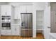 Modern kitchen features stainless steel appliances, white cabinetry, and a convenient walk-in pantry at 2265 Lauren Dr, Las Vegas, NV 89134