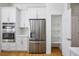 Bright kitchen with stainless steel appliances, white cabinetry, and a walk-in pantry at 2265 Lauren Dr, Las Vegas, NV 89134