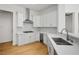 Modern kitchen featuring white cabinets, stainless steel appliances, and a wine cooler at 2265 Lauren Dr, Las Vegas, NV 89134