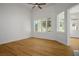 An airy living room with light wood floors, a ceiling fan, and window shutters providing natural light at 2265 Lauren Dr, Las Vegas, NV 89134