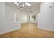 Open living room featuring hardwood floors and stylish lighting at 2265 Lauren Dr, Las Vegas, NV 89134