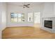 Bright living room with wood floors, a fireplace, and plantation shutters, offering ample natural light at 2265 Lauren Dr, Las Vegas, NV 89134