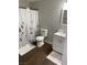 Clean bathroom with white vanity, toilet, and floral shower curtain at 231 W Horizon Ridge Pkwy # 514, Henderson, NV 89012