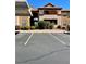 Inviting condo complex with well-maintained landscaping, numbered parking spots, and a covered entry way at 231 W Horizon Ridge Pkwy # 514, Henderson, NV 89012