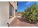 Rock backyard showing a stone footpath and a window with brown trim at 2478 Cordoba Bluff Ct, Las Vegas, NV 89135