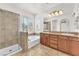 Bathroom featuring double sinks, a soaking tub, and a separate glass-enclosed shower at 2478 Cordoba Bluff Ct, Las Vegas, NV 89135