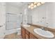 Bathroom with double vanity, granite countertop, tiled floor and shower/tub combo at 2478 Cordoba Bluff Ct, Las Vegas, NV 89135