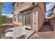 The patio includes a concrete slab, rock landscaping and a sliding glass door entrance at 2478 Cordoba Bluff Ct, Las Vegas, NV 89135