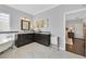 Elegant bathroom with marble floors, dual sink vanity, and garden tub at 2597 Belgreen St, Las Vegas, NV 89135