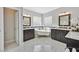 Luxurious bathroom featuring a clawfoot tub, marble floors, and dark wood cabinets at 2597 Belgreen St, Las Vegas, NV 89135