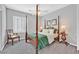 Traditional bedroom with four poster bed, ceiling fan, and shuttered windows at 2597 Belgreen St, Las Vegas, NV 89135