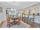 Inviting dining area with hardwood floors and stylish lighting fixtures at 2597 Belgreen St, Las Vegas, NV 89135