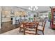 Open-concept dining area flowing into the kitchen and living spaces at 2597 Belgreen St, Las Vegas, NV 89135