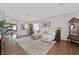 Bright living room with hardwood floors, a neutral palette, and a comfortable sofa at 2597 Belgreen St, Las Vegas, NV 89135