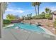 Inviting pool featuring a tiled edge, tranquil fountains, and manicured landscaping create a backyard oasis at 2597 Belgreen St, Las Vegas, NV 89135