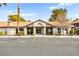 Exterior of well maintained clubhouse with blue accessible parking spot and desert landscaping at 2606 S Durango Dr # 276, Las Vegas, NV 89117