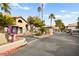 View of community gate, desert landscaping, and mailboxes at 2606 S Durango Dr # 276, Las Vegas, NV 89117