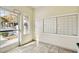 Indoor mailroom area with tile floor, many mailboxes, and glass door to the exterior at 2606 S Durango Dr # 276, Las Vegas, NV 89117