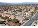 Expansive aerial shot showcasing a neighborhood with well-kept homes, lush landscaping, and community layout at 2921 Hayden Creek Ter, Henderson, NV 89052