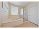 Bright bathroom with a soaking tub and a glass-enclosed shower at 2921 Hayden Creek Ter, Henderson, NV 89052