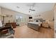 Comfortable bedroom with hardwood floors, a ceiling fan, and a large window at 2921 Hayden Creek Ter, Henderson, NV 89052