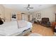 Bright bedroom featuring hardwood floors, seating area, and ample natural light at 2921 Hayden Creek Ter, Henderson, NV 89052