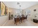 Elegant dining room with chandelier lighting, complemented by natural light from multiple windows at 2921 Hayden Creek Ter, Henderson, NV 89052