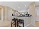 Modern kitchen with a breakfast bar, white cabinets, and stainless steel appliances at 2921 Hayden Creek Ter, Henderson, NV 89052