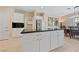 Spacious kitchen island with black granite countertops and modern white cabinetry at 2921 Hayden Creek Ter, Henderson, NV 89052