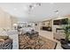 Open-concept living room featuring tile floors, a fireplace, and neutral decor at 2921 Hayden Creek Ter, Henderson, NV 89052