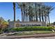 Attractive Sun City Anthem signage surrounded by mature palm trees and desert landscaping at 2921 Hayden Creek Ter, Henderson, NV 89052