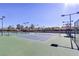 Well-maintained community tennis courts with professional surfacing and lighting for evening play at 2921 Hayden Creek Ter, Henderson, NV 89052