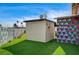 Backyard featuring artificial turf and white exterior at 321 Agora Way, Las Vegas, NV 89110