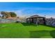 Spacious backyard with gazebo, privacy wall, and artifical lawn at 321 Agora Way, Las Vegas, NV 89110