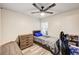 Well lit bedroom with a ceiling fan, hard wood floors, a dresser, and a small bed at 321 Agora Way, Las Vegas, NV 89110