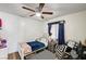 Cozy bedroom with a daybed, a window, and a patterned rug at 321 Agora Way, Las Vegas, NV 89110