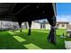 Backyard gazebo featuring well manicured lawn and overhead lighting at 321 Agora Way, Las Vegas, NV 89110