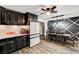 Open-concept kitchen and dining area with dark cabinets and stainless steel appliances at 321 Agora Way, Las Vegas, NV 89110