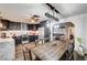 Spacious kitchen with modern appliances, dark cabinetry, and a rustic wooden dining table at 321 Agora Way, Las Vegas, NV 89110