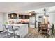 Open-concept kitchen with bar seating, connecting seamlessly to the dining and living areas at 321 Agora Way, Las Vegas, NV 89110