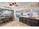 A kitchen with a breakfast bar overlooking a dining area, and an adjoining living room space at 321 Agora Way, Las Vegas, NV 89110