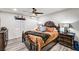 Comfortable main bedroom with a ceiling fan, window, and an upholstered platform bed at 321 Agora Way, Las Vegas, NV 89110