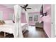 Bedroom featuring ample natural light, wood floors, and a statement chandelier at 382 Gracious Way, Henderson, NV 89011