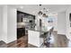 Modern kitchen featuring a granite island with barstool seating and stainless steel appliances at 382 Gracious Way, Henderson, NV 89011