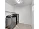 Well-lit laundry room featuring modern washer and dryer units at 382 Gracious Way, Henderson, NV 89011