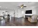 Open-concept living room with hardwood floors, recessed lighting, and adjacent kitchen at 382 Gracious Way, Henderson, NV 89011