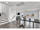 Spacious living room with hardwood floors, recessed lighting, and an adjacent staircase at 382 Gracious Way, Henderson, NV 89011